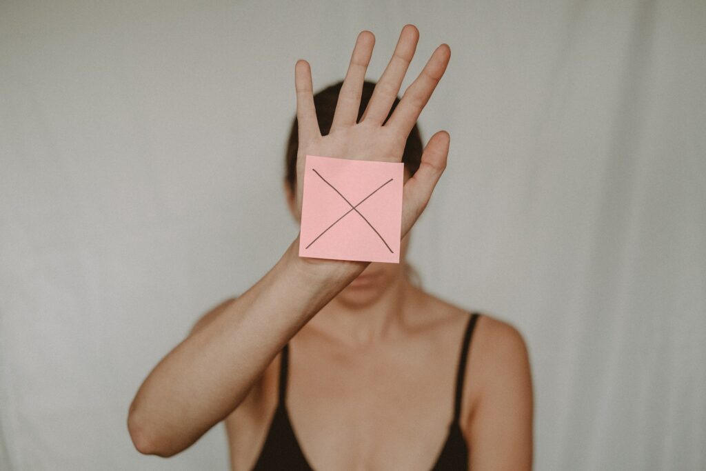 This is an image of a female with an X sign on her palms, depicting things they should not do to save landlords from being a victim of rental fraud.